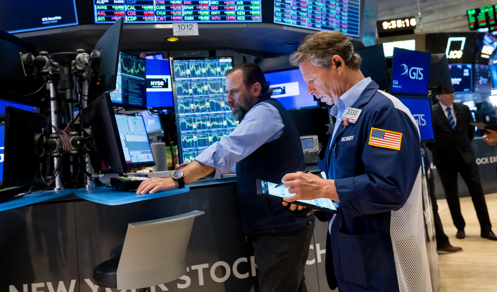 Traders work on the floor of the New York Stock Exchange on May 7, 2025.