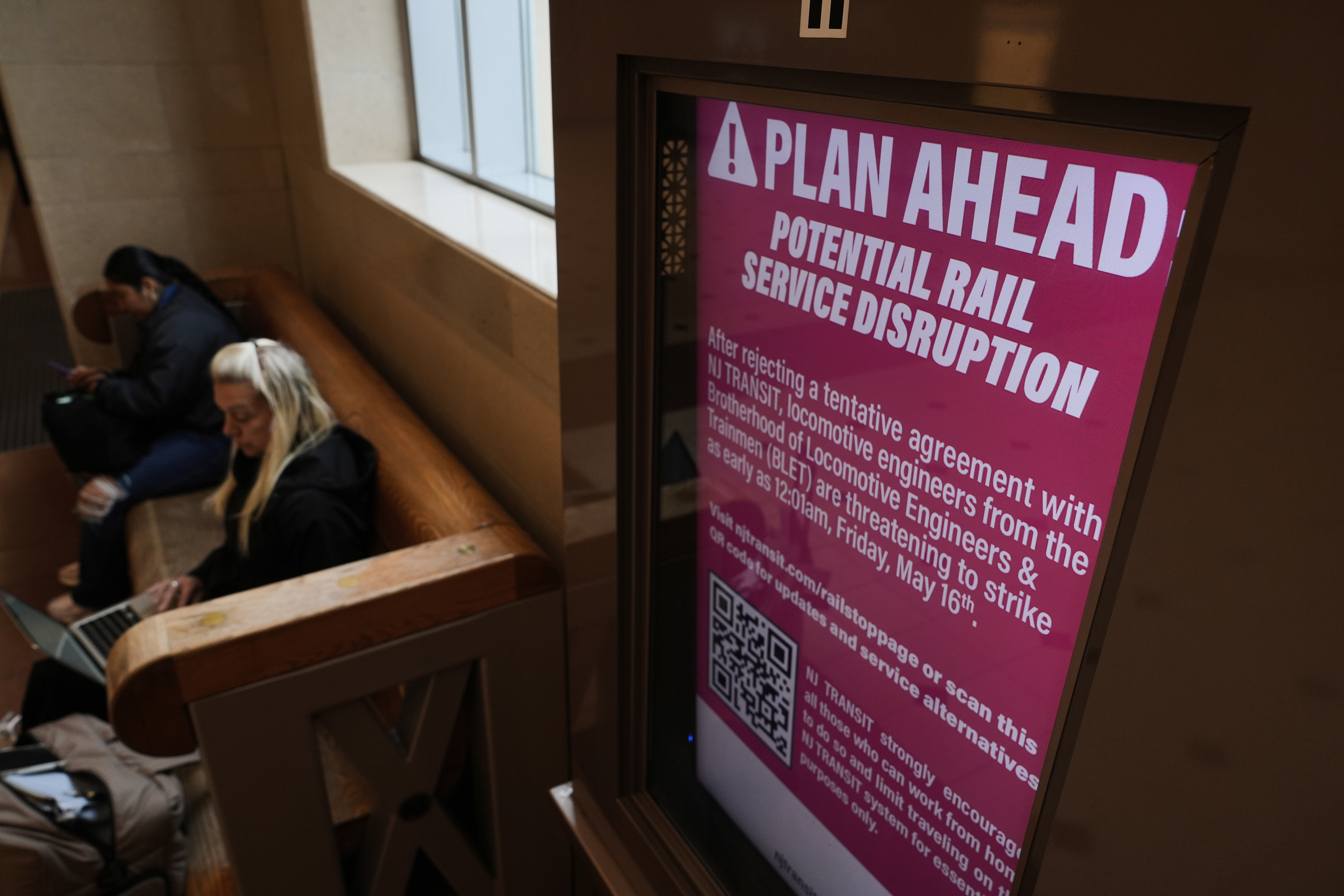 An electronic display advises commuters of potential NJ Transit service disruptions at the Secaucus Junction station in Secaucus, N.J., Wednesday, May 14, 2025.